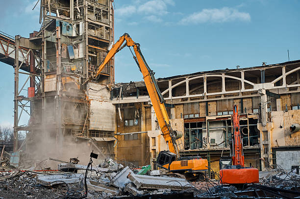 istock Destroyer excavator with large manipulator near factory 2206406064
