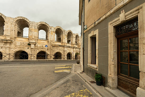 Partial view of the Roman Theatre Arena from a street  Arles, France, Europe