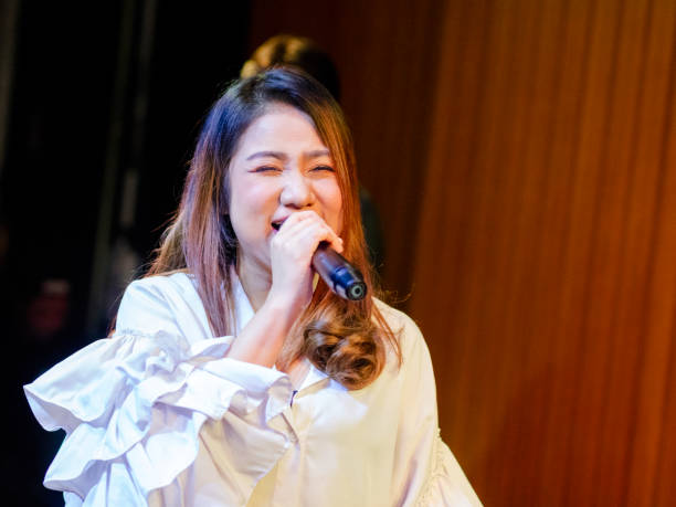 istock Happy performing female thai singer 2206411078