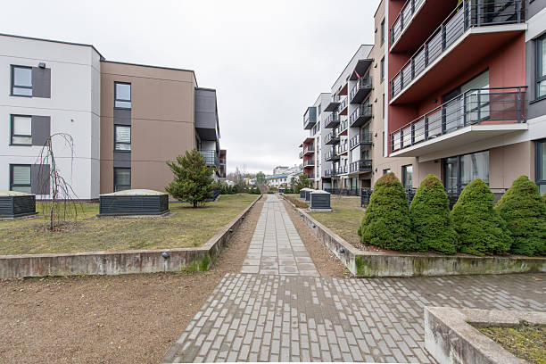 istock Modern Apartment Building Exterior with Green Lawn and Walking Path 2206411970