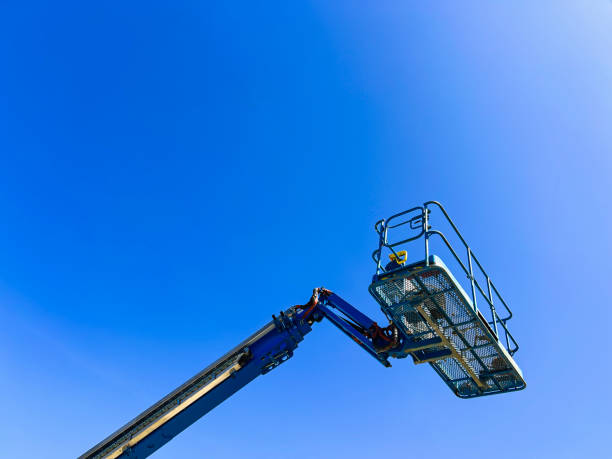 istock Mobile Crane Mid-Air Against a Clear Blue Sky 2206413645
