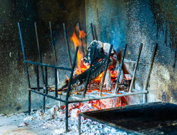 Preparing the fire at an Argentinian steakhouse to grill meat