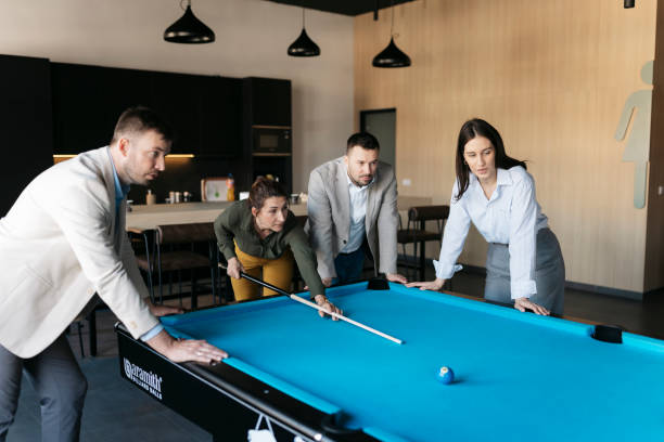 istock Business team playing pool in the office during a break 2206418777