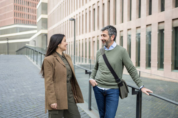 istock Business people talking outside office building 2206419188
