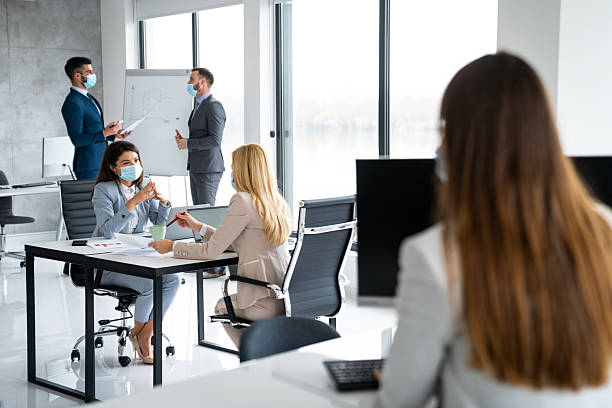 istock Socially Distanced Business Meeting in Office 2206424100