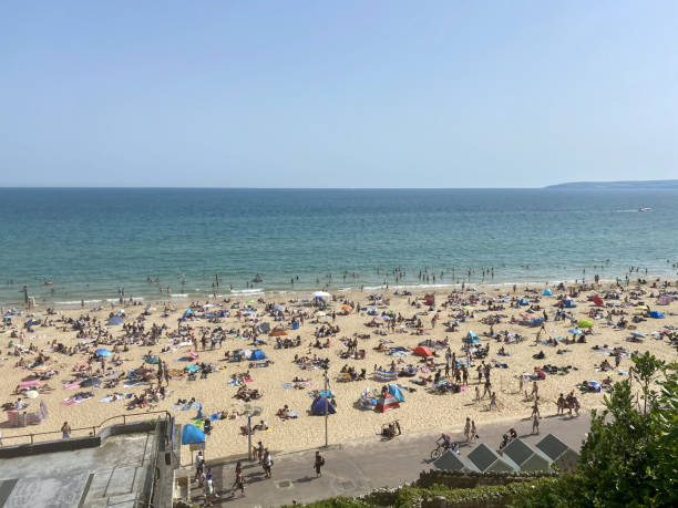 istock Bustling Beach Bliss Crowded Shoreline by the Ocean 2206424726