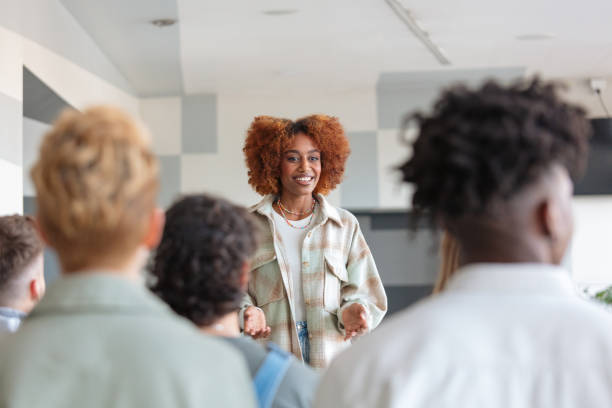 istock Young woman giving presentation to university students 2206426756