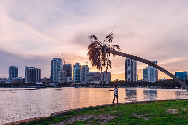 St Petersburg, Florida, USA - People walking in  downtown park at sunset time