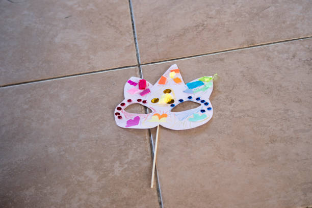 paper mask for carnival made by a boy