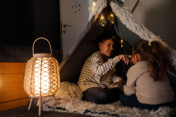 istock Sibling Bonding in a Cozy Blanket Fort 2206429563