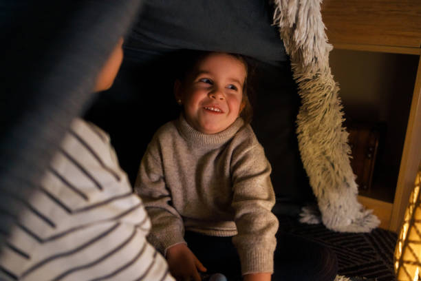 istock Sibling Bonding in a Cozy Blanket Fort 2206429569