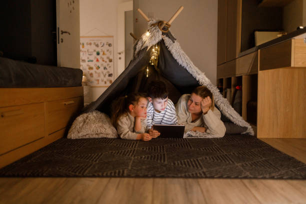 istock Family Bonding with a Digital Tablet in a Cozy Blanket Fort 2206429573