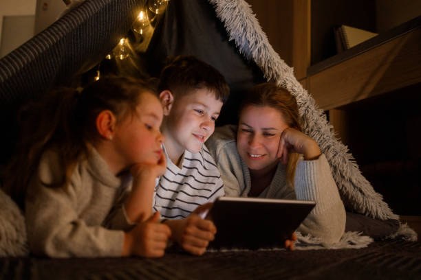 istock Family Bonding with a Digital Tablet in a Cozy Blanket Fort 2206429588