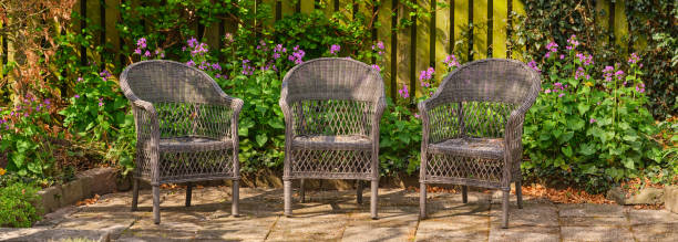 istock Three Garden Chairs in a Vibrant Floral Patio Setting 2206429696