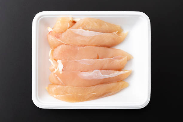 istock Chicken fillet on a black background. 2206437090