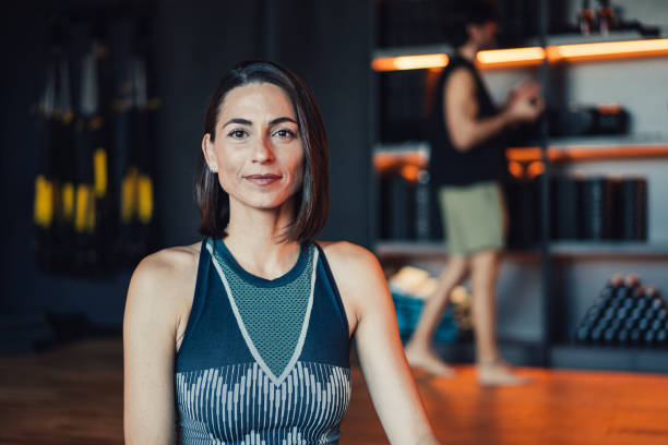 istock Confident young woman working out in a gym. 2206437328