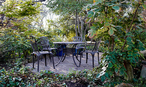 Table with book and cup in the garden.Shallow DOF.