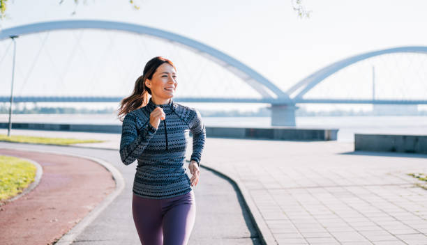istock Woman jogging in the city. 2206438551