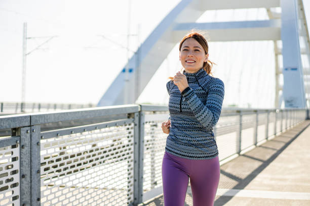istock Woman jogging in the city. 2206438558