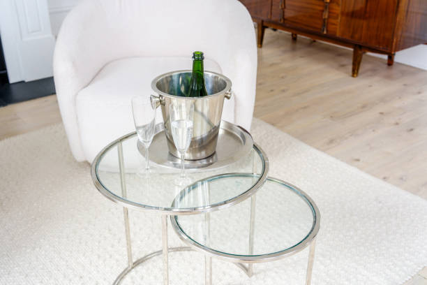 istock Luxurious sparkling wine  Bottle with Ice Bucket on Glass Table 2206439118