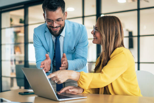 istock Two business coworkers talking 2206439611