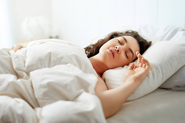istock Woman is sleeping in her bedroom 2206450224