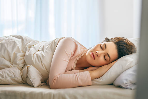 istock Woman is sleeping in her bedroom 2206450230