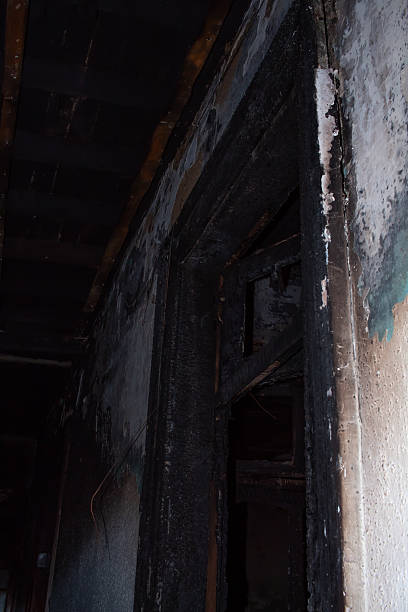 istock A black door with a burnt frame 2206455438