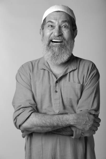 side view of man with stylish hair and beard on white background