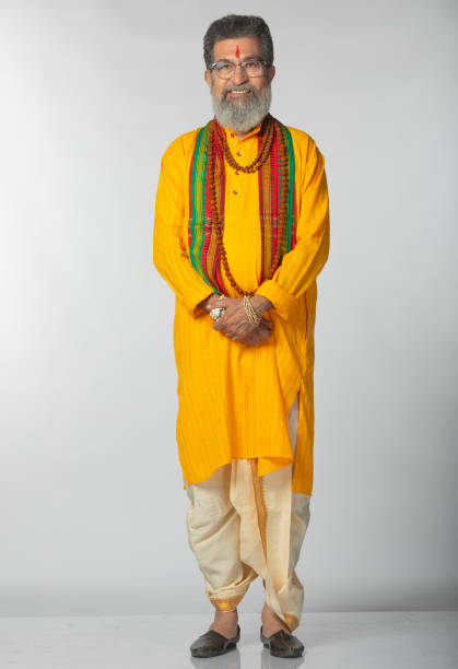 istock Old priest with rudraksha posing on white background 2206460801