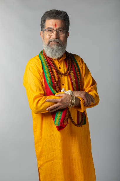 istock Old priest with rudraksha posing on white background 2206460836
