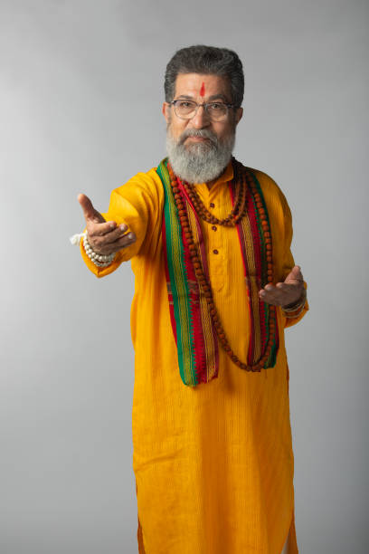 istock Old priest with rudraksha posing on white background 2206460885