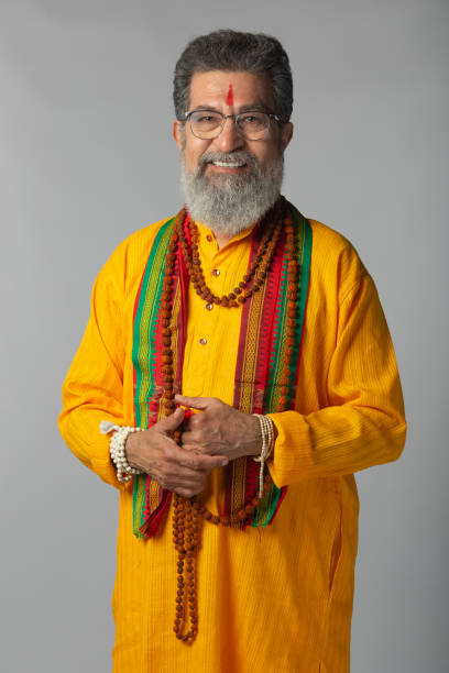 istock Old priest with rudraksha posing on white background 2206461018