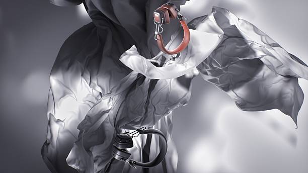 A soft grey fabric swirls behind two modern headphones, evoking motion and clarity.