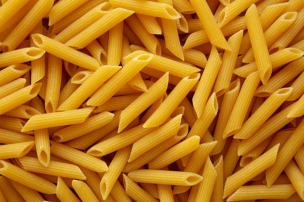 istock Raw Organic Penne Pasta Background 2206462962