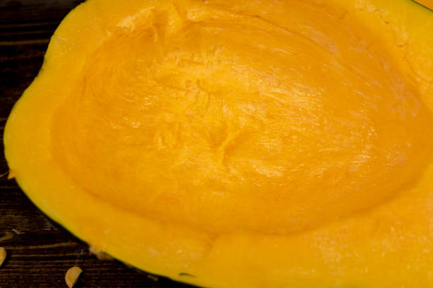 istock freshly cut orange pumpkin with cooking seeds 2206464233