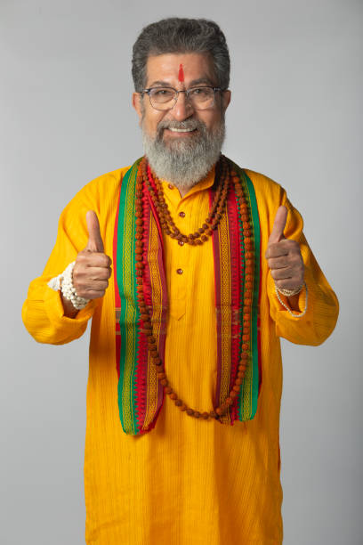 istock Old priest with rudraksha posing on white background 2206465291