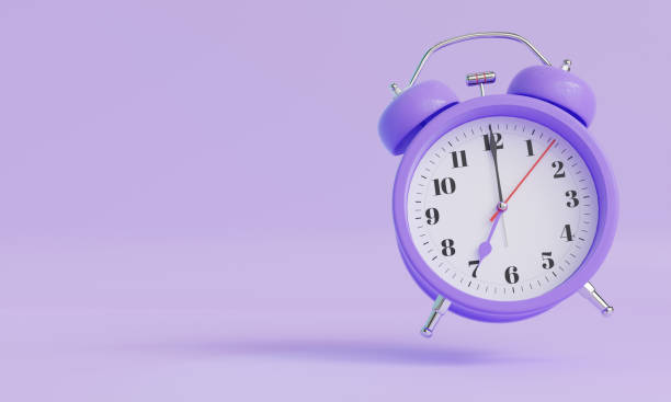 istock Purple Vintage Alarm Clock Floating on Pastel Background 2206465847