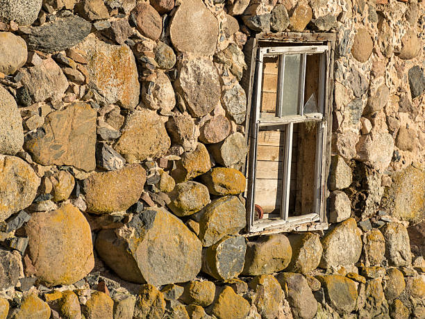 picture with wooden window in a stoned wall