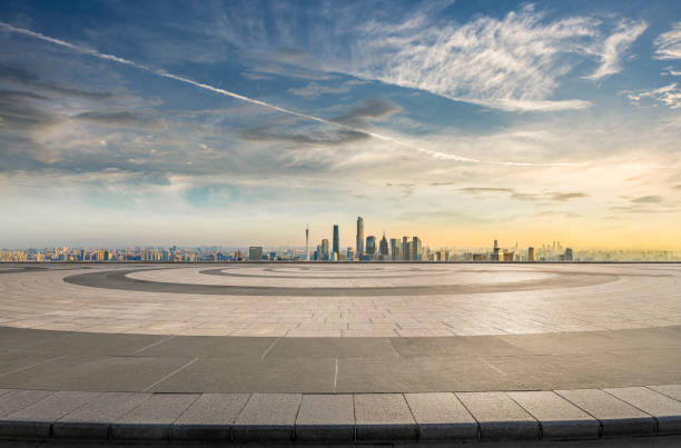 istock Empty brick floor and modern city skyline background at sunset 2206467541