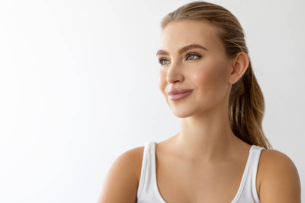 istock Pretty woman standing against white background 2206470532