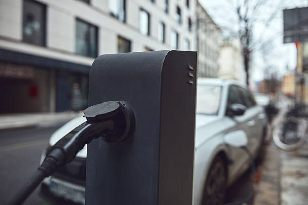 istock Charging electric vehicle on a public charger. 2206473742