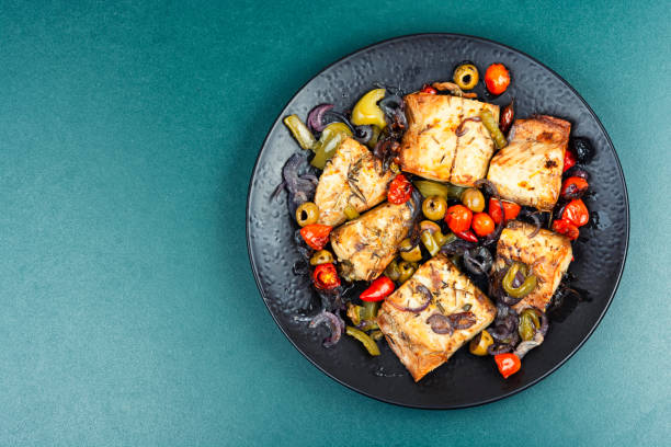 istock Roasted fish fillet and baked vegetables. 2206477194