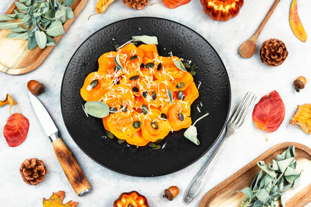 istock Plate of pumpkin ravioli with sage leaves. 2206479151