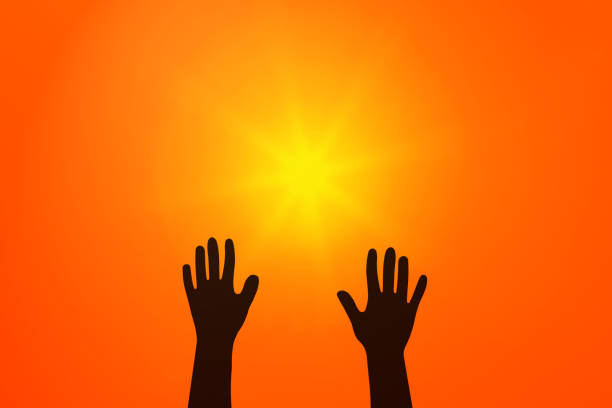 Hands raised to the sky. Yellow sun in red sky.