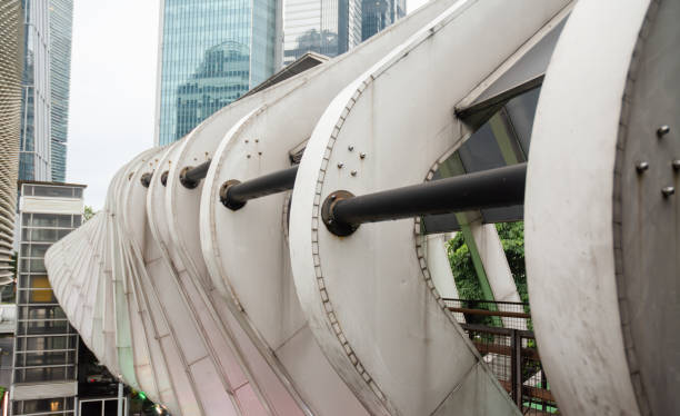 istock Aesthetic Public Crossing Bridge with Curved Square Truss Frame Design 2206481621