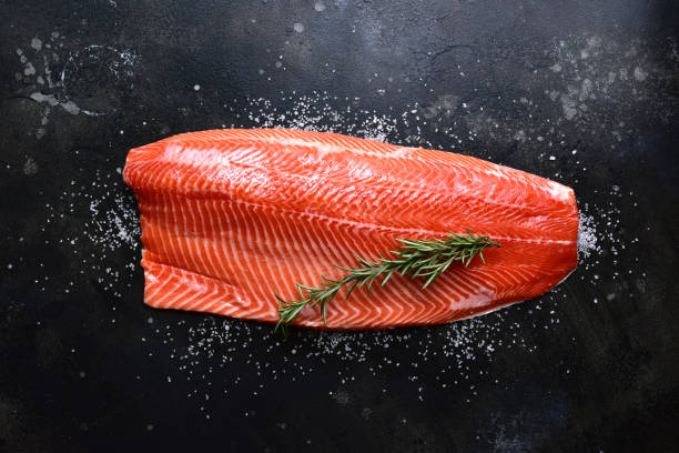 istock Fresh salmon fillet with spices. Top view with copy space. 2206483135