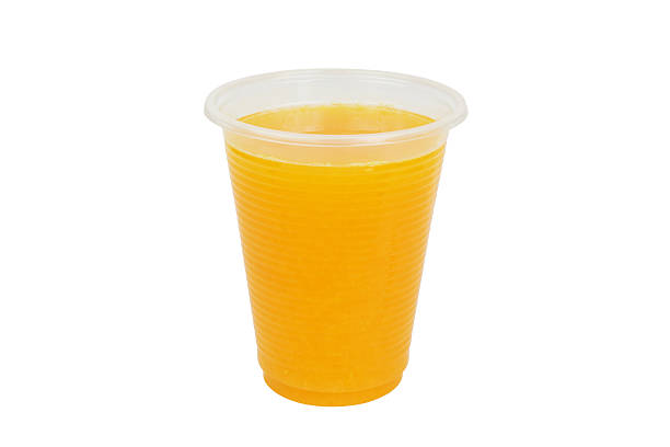 istock Fresh orange juice in plastic cup isolated 2206483411