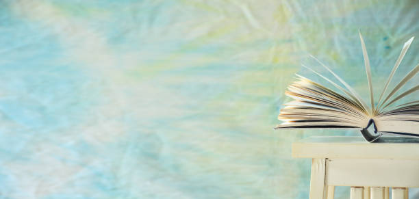 Open book on fabric background,education,reading,book fair concept.Negative space with large free copy space