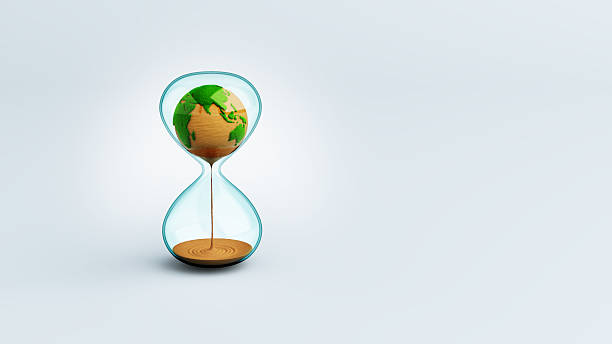 istock Hourglass with Globe green grass and sand flow down. Global Warming. Global nature water and forest conservation. TIme of Energy World Ecological And Environment. clipping path. 3D Illustration. 2206487105